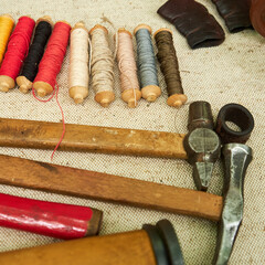 Making medieval vintage leather shoes, items for creating retro boots. Reconstruction of the events...