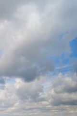 Fototapeta premium White cumulus clouds in the blue sky. Bright beautiful sky, copy space background