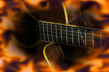 Obraz na płótnie Canvas Acoustic guitar with fire flame screen.