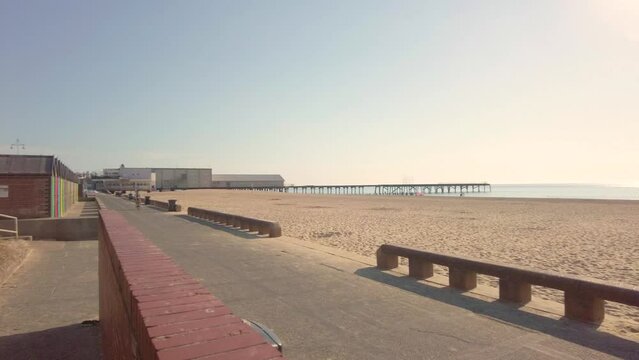 Panning shot of Lowestoft promenade on a bright and sunny morning