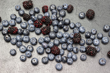 Ripe berries of blackberries and blueberries.