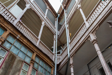 Fototapeta premium An incredible wooden facade in a historic building in the Old Town of Tbilisi. Georgia country