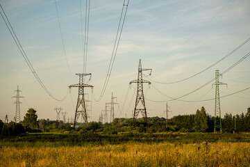 Power line background green meadows and blue sky