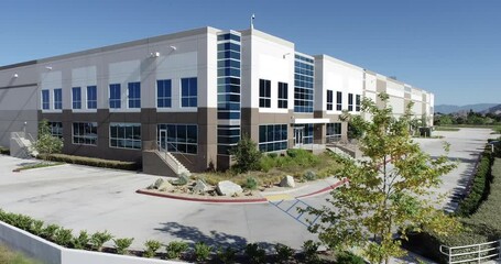 4K Aerial View of New Commercial Industrial Building.
 - Powered by Adobe