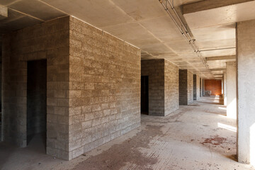 Inside the building under construction. Concrete walls of the new house