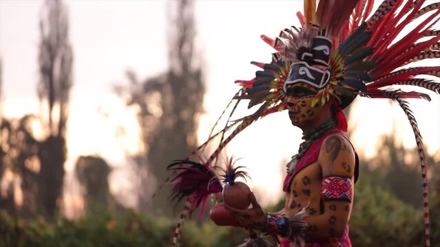 mexican man prehispanic indian dancer at day of the dead ceremony with feathered plume