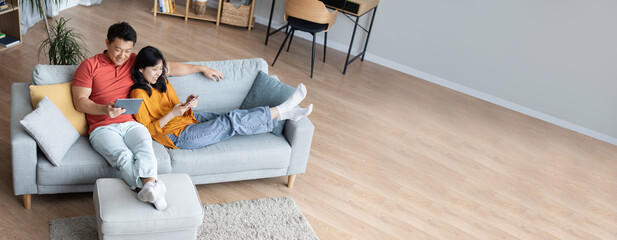 Wide Extended Banner With Happy Asian Couple Relaxing Together At Home