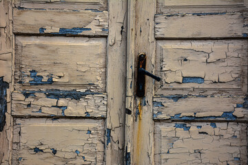 Texture of old painted stained wooden door .