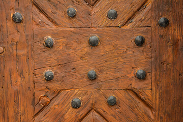Texture of old painted stained wooden door .