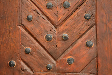 Texture of old painted stained wooden door .