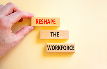 Reshape the workforce and support symbol. Concept words Reshape the workforce on wooden blocks. Businessman hand. Beautiful white background. Business reshape the workforce quote concept. Copy space