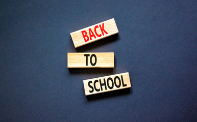 Back to school and support symbol. Concept words Back to school on wooden blocks. Beautiful black...