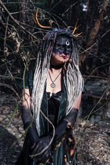 Forest witch in a pine forest