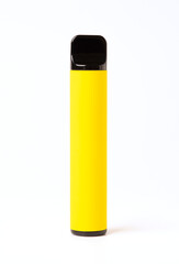 Yellow disposable electronic cigarette isolated on a white background. The concept of smoking, vaping and nicotine.