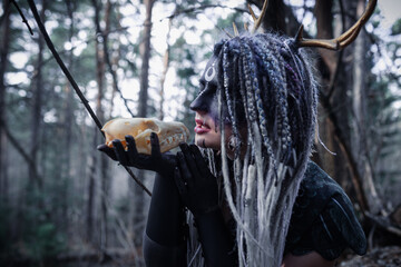 Forest witch in a pine forest