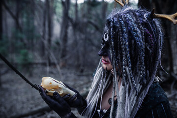 Forest witch in a pine forest