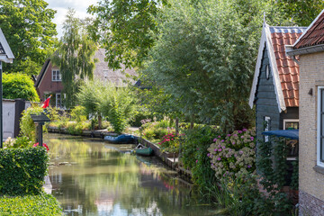 A river flows through the picturesque Dutch village of Linschoten.