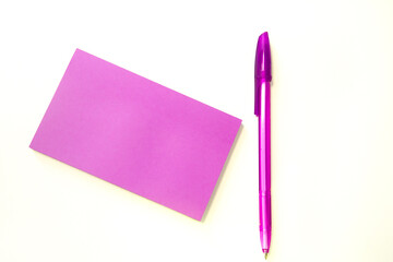 Pink envelope with blank paper and pen, greeting card or invitation mockup, top view, copy space