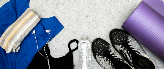 Healthy lifestyle, sport or athlete's equipment set : bottle of water with earphones and sneakers,...