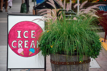 Ice cream sign on sidewalk
