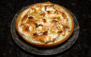Traditional lemon pie in selective focus. Portrait