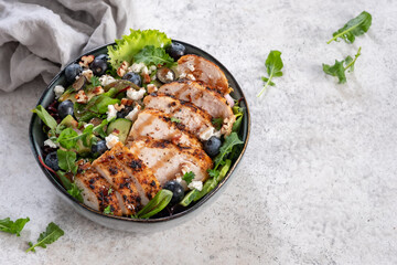 Grilled chicken breast, fillet and fresh vegetable salad of lettuce, arugula, spinach, avocado,...