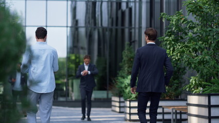 Diverse corporate people walking office building in suit. Businesspeople concept