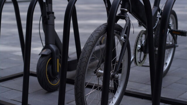 Closeup electric scooter bicycle standing on shared parking lot. City mobility