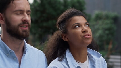 Obraz premium Two employees talking walking to office portrait. Joyful corporate workers.