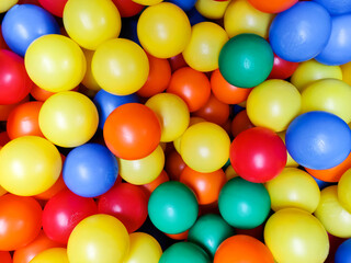 Fototapeta na wymiar Many colorful plastic balls . Ball pit at kids play area. Colorful background.