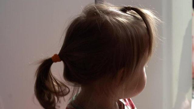 Close up baby dirty Face. Funny child eat chocolate. little toddler kid in the kitchen eating candy in the morning. happy family eats sweets girl dream concept. lifestyle cocoa confection.Childhood