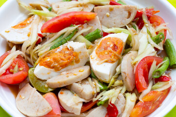 Spicy papaya salad with salted egg and vietnamese pork sausage