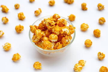 Honey caramel popcorn on white background.