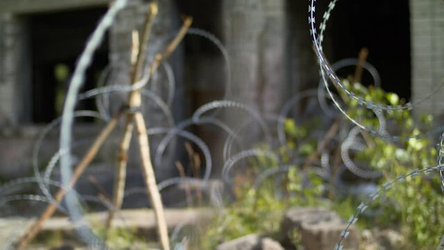 Ukraine war barbed wire. Destroyed Donetsk.
Barrage against military invasion.
Field military barrier, protection of civilians.