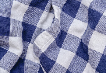 Fototapeta na wymiar Blue and white checkered kitchen towel detail