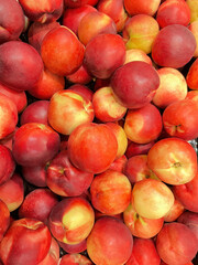 Juicy ripe peach nectarine for sale at farmers market