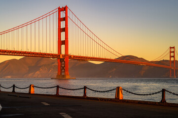 golden gate bridge at sunrise with clear sky