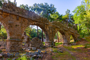Fototapeta na wymiar Remains of aquaeduct in ancient Lycian city Faselis located near modern town Tekirova in Kemer district of Antalya Province, Turkey.