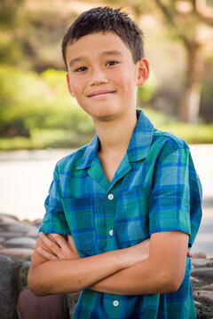 Outdoor portrait of a mixed race Chinese and Caucasian boy.