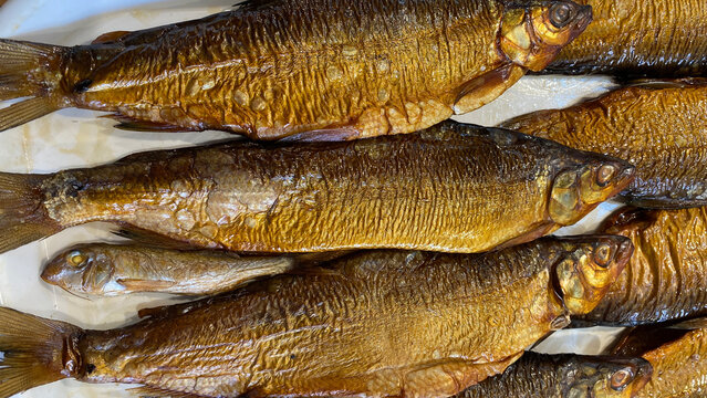 Natural background with smoked fish close-up