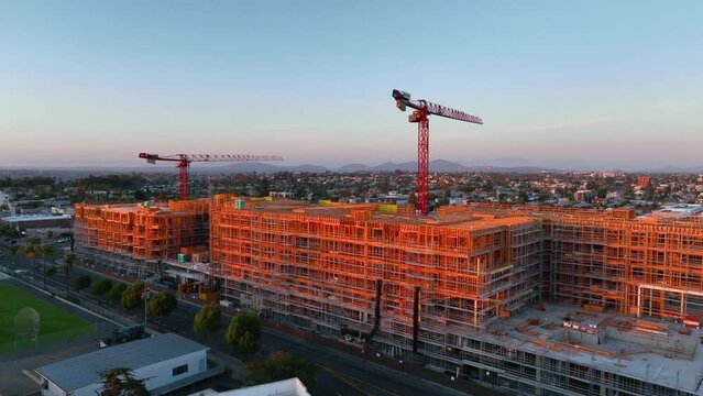 Panning aerial shot, construction site with birds, drone, 4k