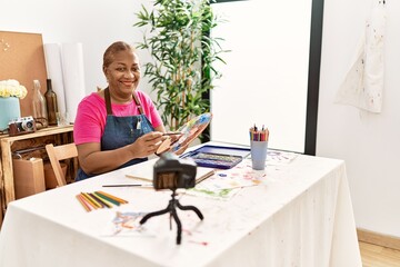 Senior african american woman recording draw tutorial at art studio