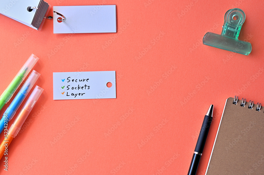 Poster there is word card with the word secure socket layer on the desk.