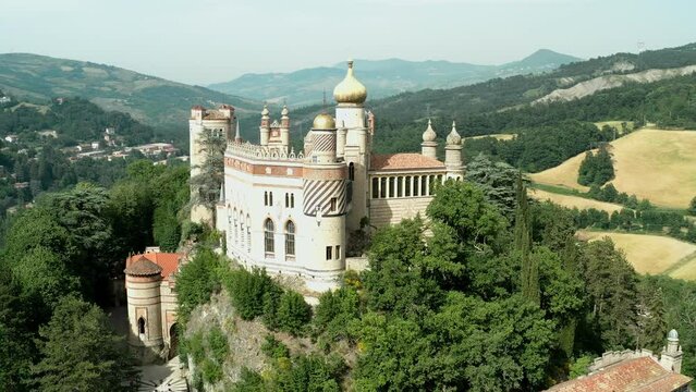 Aerial drone panoramic view of the Rocchetta Mattei castle in Italy on sunny summer day, view from above. High quality 4k footage