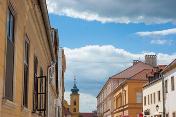 Obraz premium Osijek Street scene near Citadel in Croatia with St Michael Church in background with blue skies and clouds above.