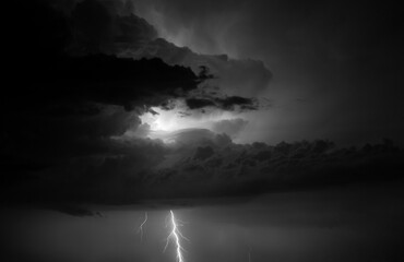 Fork lightning striking down during summer storm