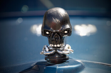 Macro Image of Skull Hood Ornament on Rat Rod Automobile