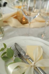 Festive table setting with beautiful floral decor, closeup