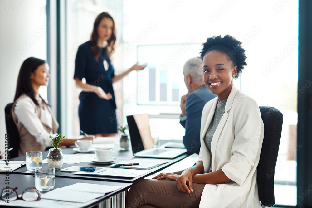 Poster happy assistant or intern looking cheerful in a team planning meeting at work. portrait of a proud e