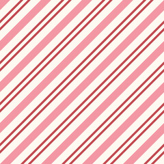 Obraz premium Seamless pattern with red, pink, and white stripes. Diagonal striped pattern for Christmas. Cute candy cane stripes.